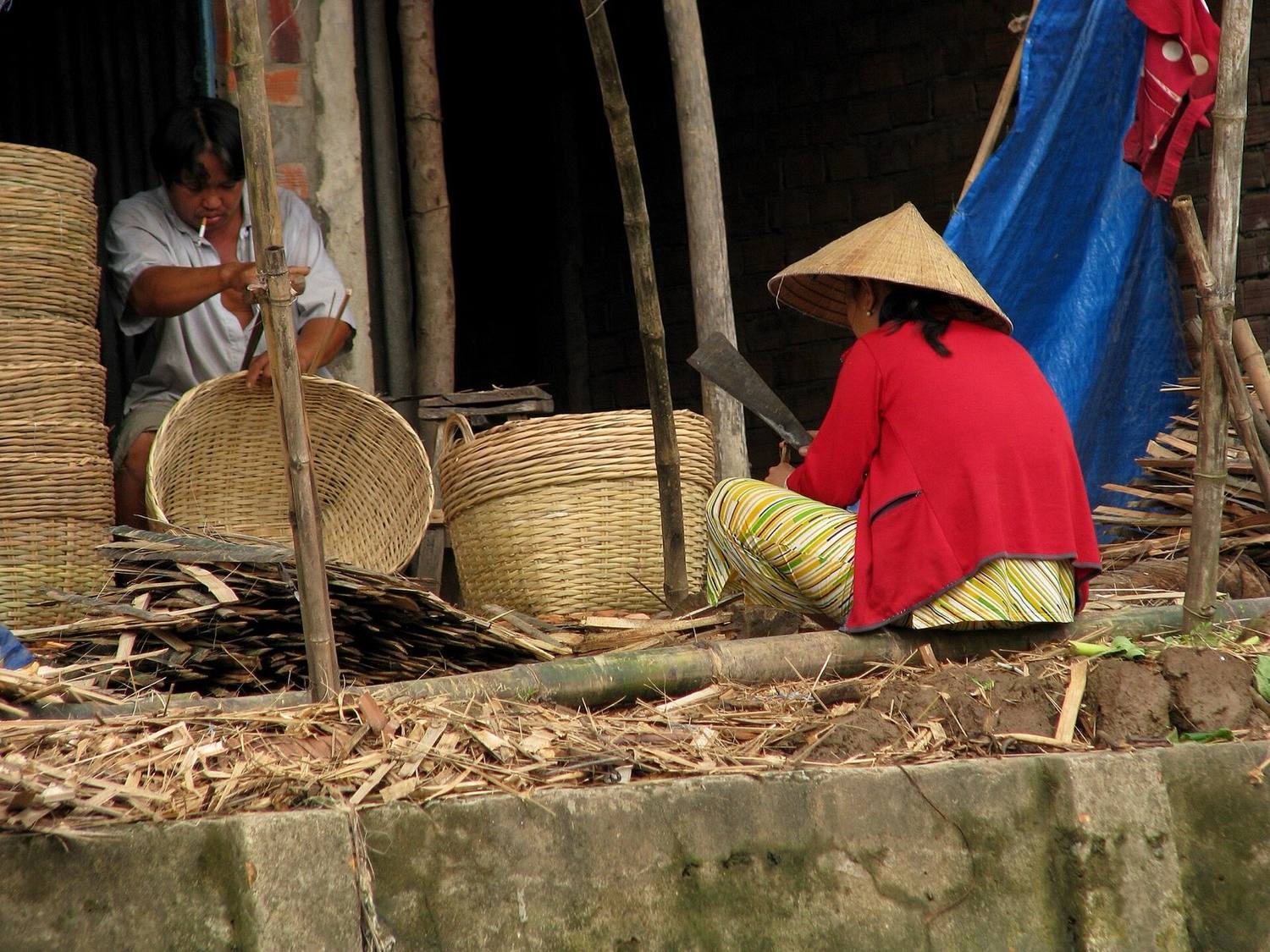 Workshop where coconut candy is cut and wrapped by hand in the Mekong Delta