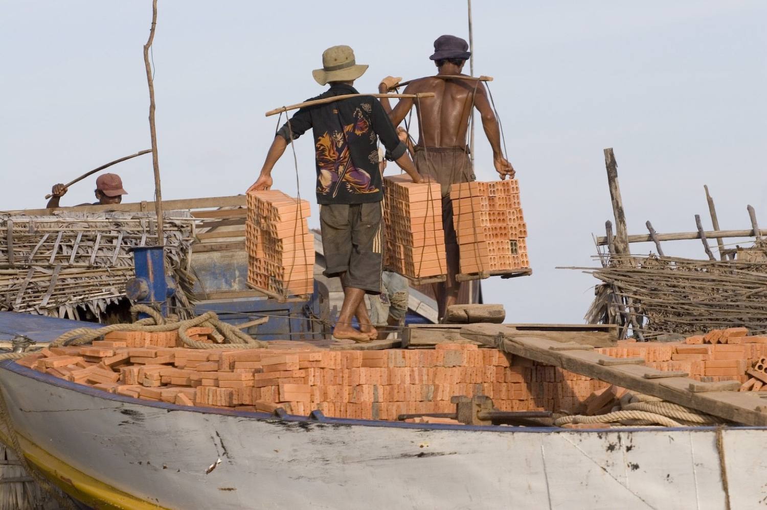 Workers on a boat on the Mekong River