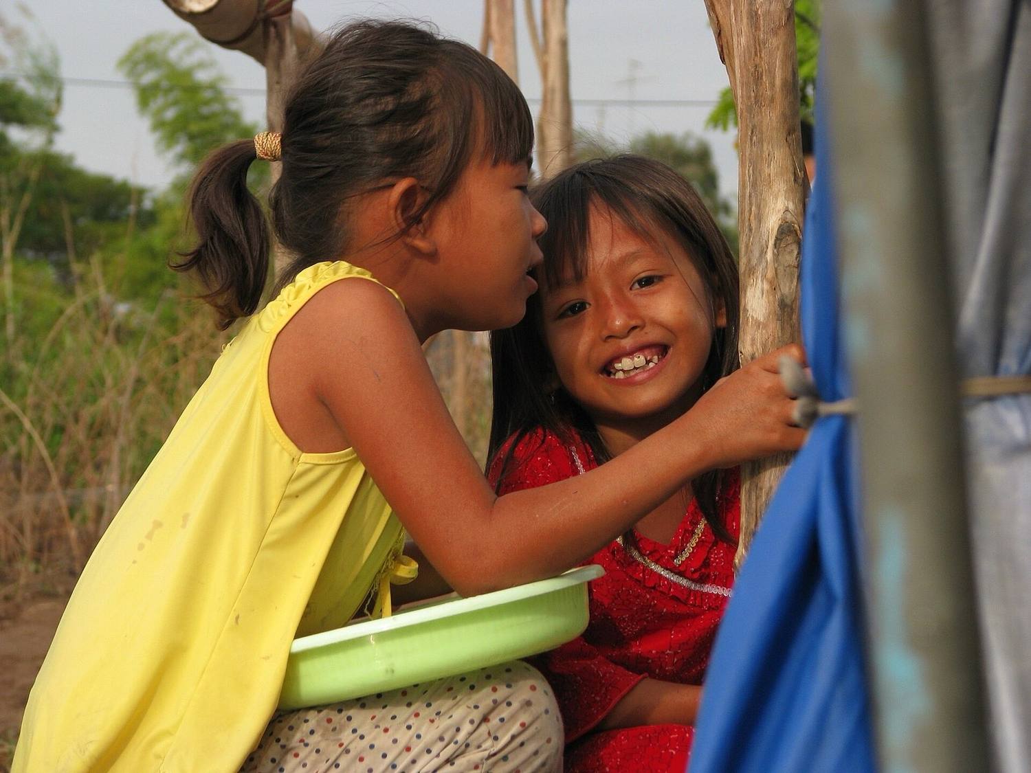 People smiling from a boat in the Mekong Delta